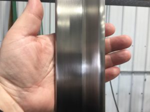 Metal Finishing - Inside Face and Edges of 3/8” Structural Stainless Angle. Straight-line of all surfaces along with an inside radius.