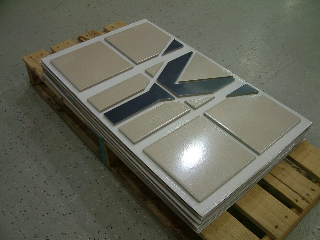 JIT Companies packages tiles in vacuum packaging.