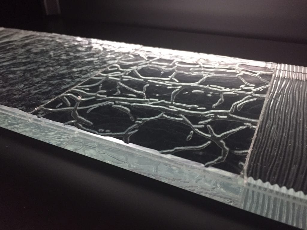 Laminated clear pattern/textured glass to heavy plate glass.