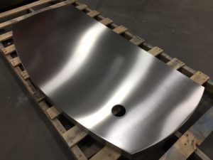 Grained Metal Finishing - Fabricated Stainless Steel Table Top with Welded Edge Seams. Straight-line #4 Finish to Remove Blemishes During Fabrication.