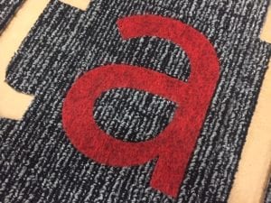 custom carpet inlays for rugs, made with waterjet cutting at JIT Companies