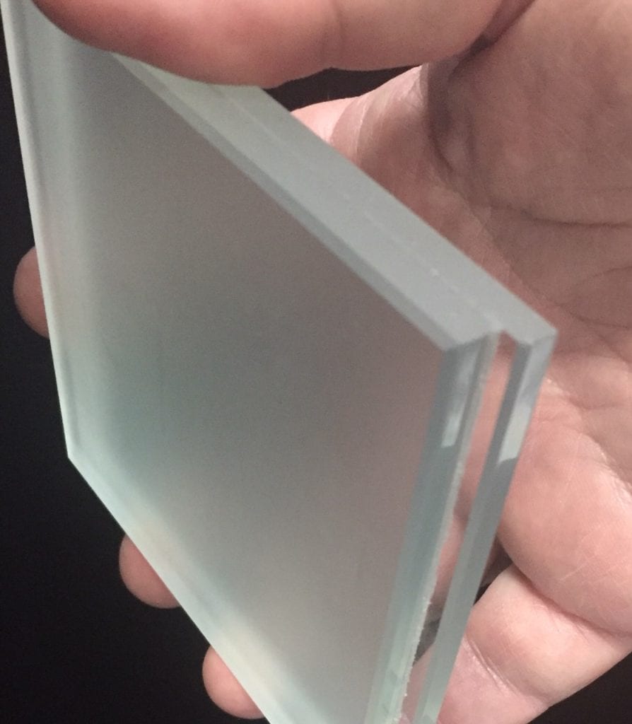Laminated custom LED Light diffuser lens with step edge.