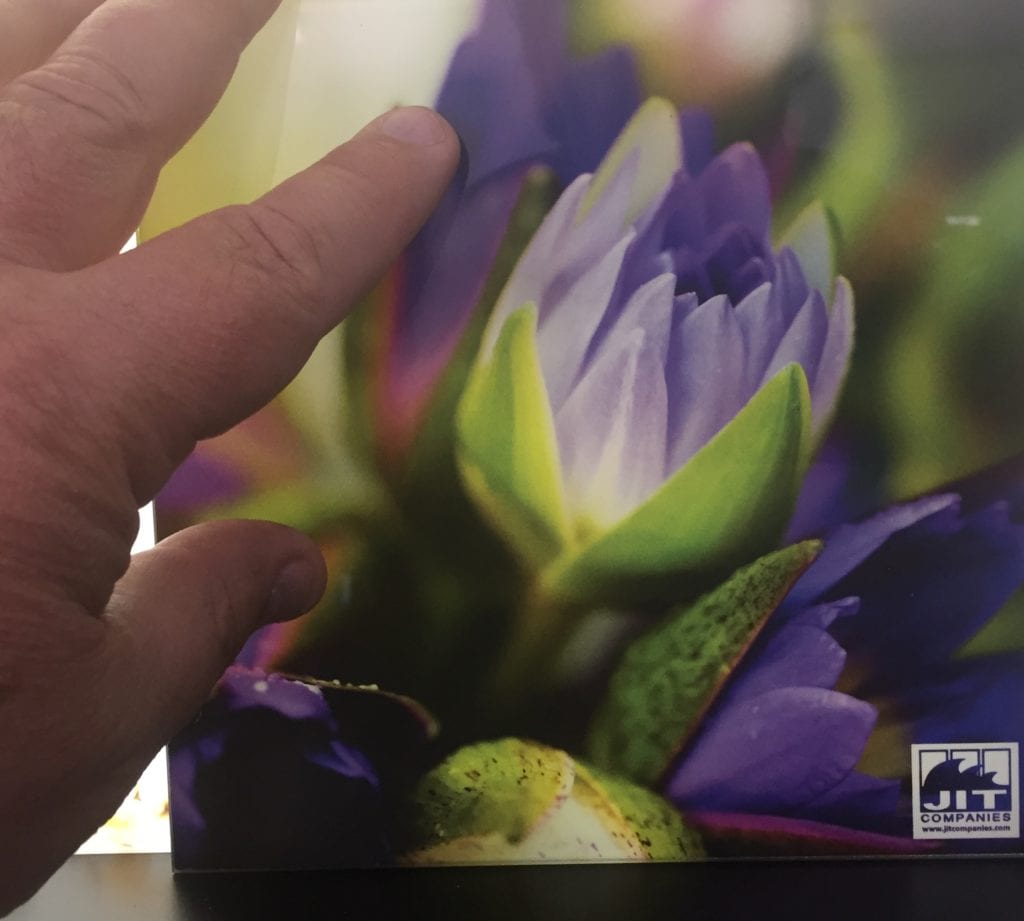 Laminated graphic film with back lighting.