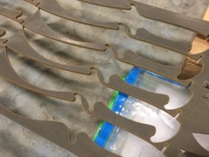 Skeleton drop from tempered steel knife blank waterjet cutouts - Bladesmiths love working with JIT Companies for Knife Making